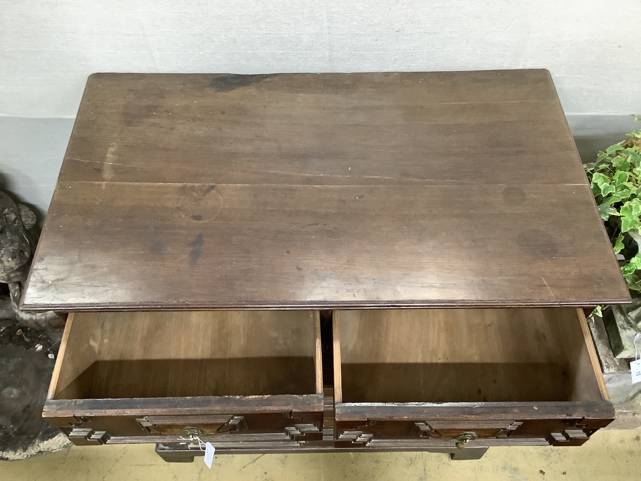 An early 18th century style geometric moulded oak chest of five drawers, width 98cm